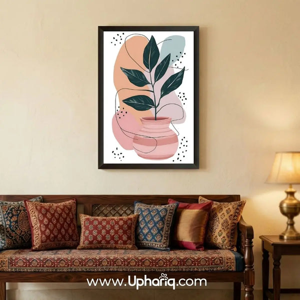 Abstract botanical leaf vase wall art mounted above a bed in a cozy modern bedroom with warm ambient lighting.