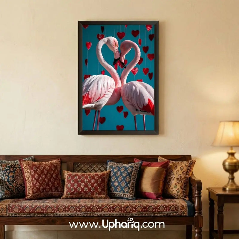 Flamingo Love Wall Art framed painting displayed above a bedroom sofa with romantic flamingo couple design and heart background