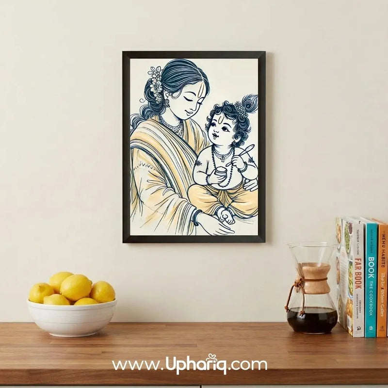 Yashoda Maiya Bal Krishna photo frame hung on cream wall above wooden table with lemons and books in modern home